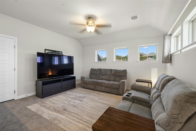 carpeted living room featuring ceiling fan and lofted ceiling