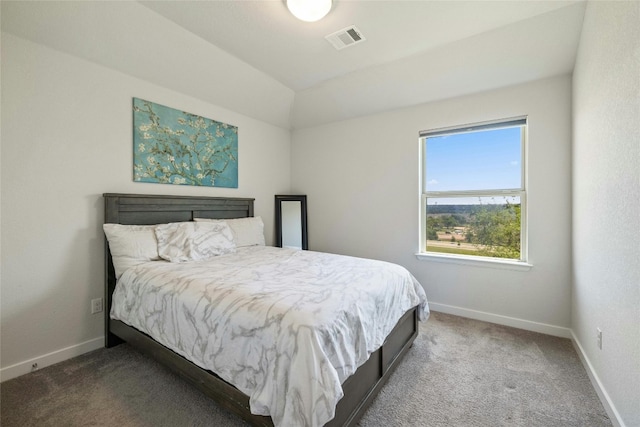 bedroom featuring baseboards, visible vents, vaulted ceiling, and carpet flooring