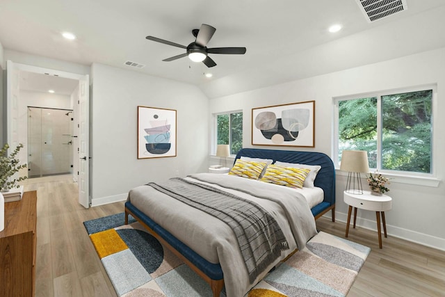 bedroom featuring vaulted ceiling, ceiling fan, and light hardwood / wood-style floors