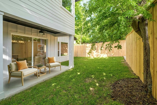 view of yard with ceiling fan