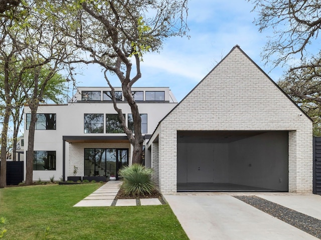 contemporary house with a front yard and a garage