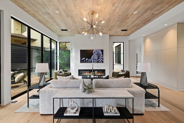 living room featuring wooden ceiling, a chandelier, and light wood-type flooring