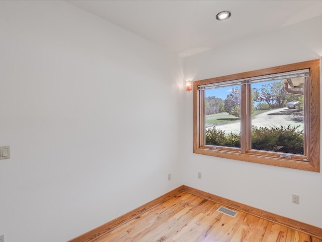 empty room with wood-type flooring