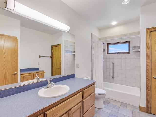 full bathroom with vanity, shower / tub combo, and toilet