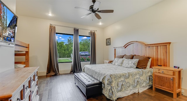 bedroom with dark wood-type flooring and ceiling fan