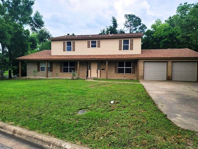 view of front of property featuring a garage and a front lawn