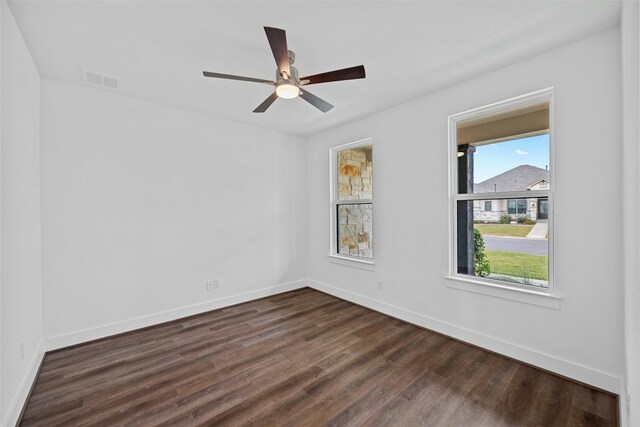 509 Sierra Lisa Cv, Liberty Hill, TX 78642 - unfurnished room featuring dark wood-style flooring and ceiling fan