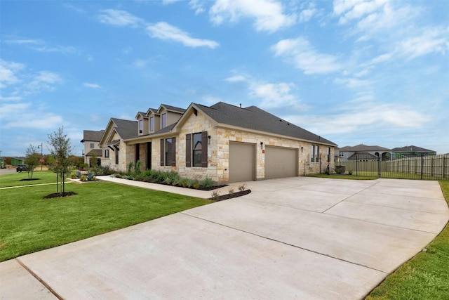 view of front of property featuring a front yard and a garage