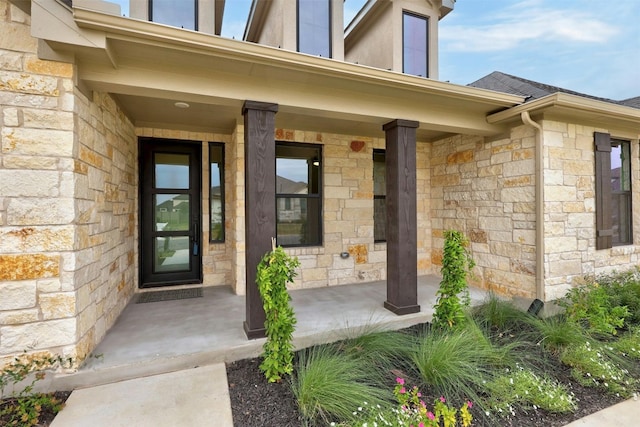 property entrance featuring a porch