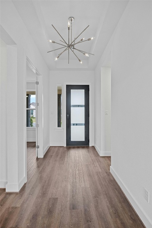 509 Sierra Lisa Cv, Liberty Hill, TX 78642 - entrance foyer featuring wood finished floors and a chandelier