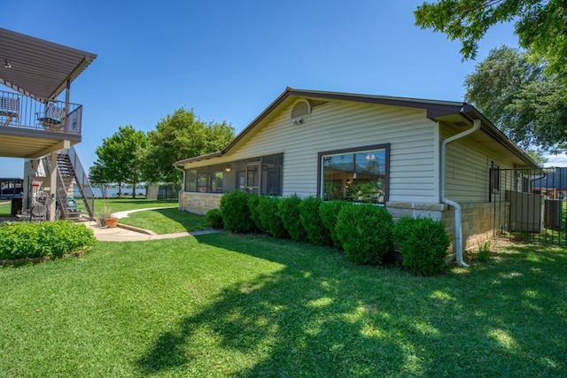 view of yard with a sunroom