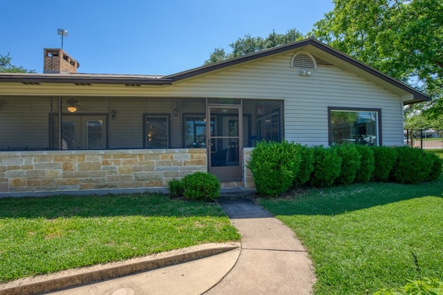 ranch-style house with a front yard