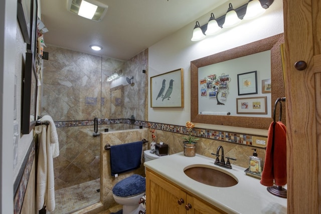 bathroom featuring tile walls, oversized vanity, walk in shower, backsplash, and toilet