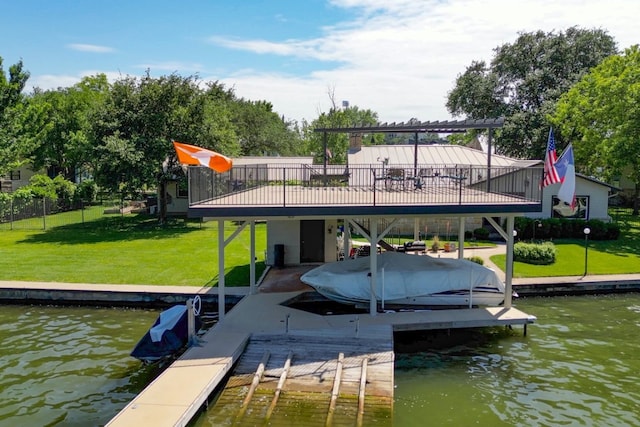 view of dock featuring a lawn and a water view