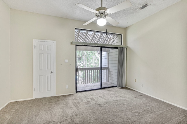 unfurnished room featuring ceiling fan, a textured ceiling, and carpet flooring