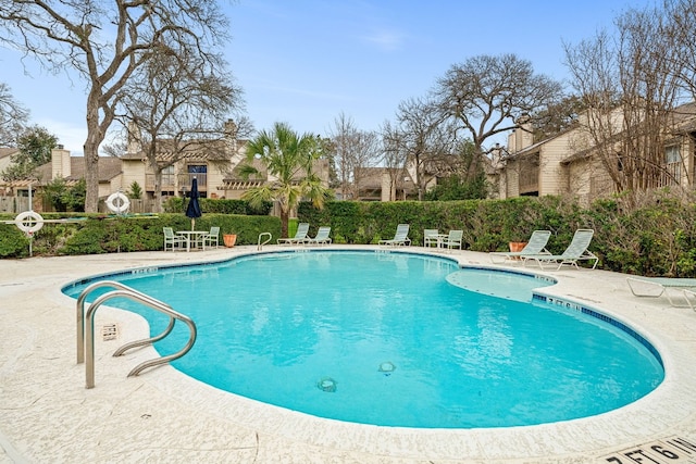 view of pool featuring a patio