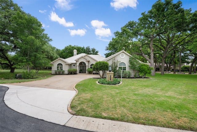 single story home featuring a front yard