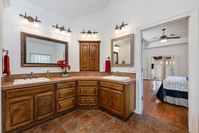 bathroom with double vanity, ceiling fan, and tile floors