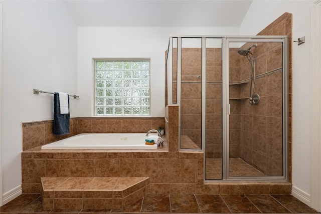 bathroom featuring tile floors and plus walk in shower