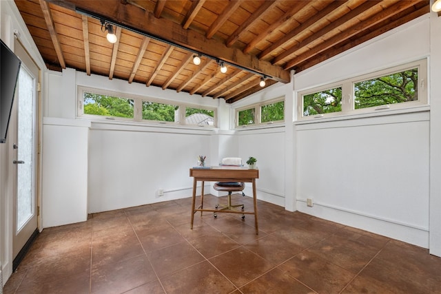 sunroom / solarium with wood ceiling, rail lighting, and vaulted ceiling with beams