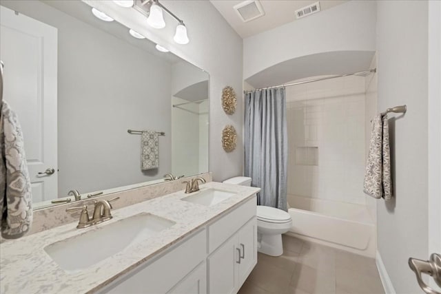 bathroom with visible vents, a sink, and shower / tub combo with curtain