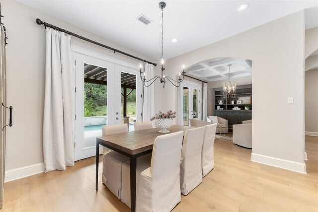 dining space with french doors, light wood-type flooring, coffered ceiling, and beam ceiling