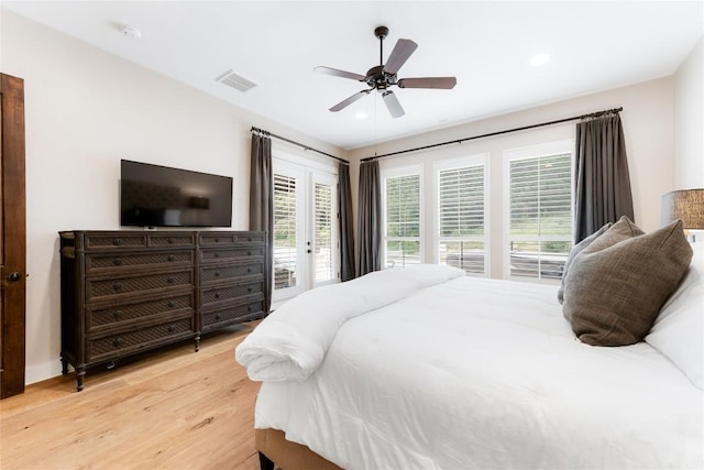 bedroom featuring access to exterior, light hardwood / wood-style flooring, and ceiling fan