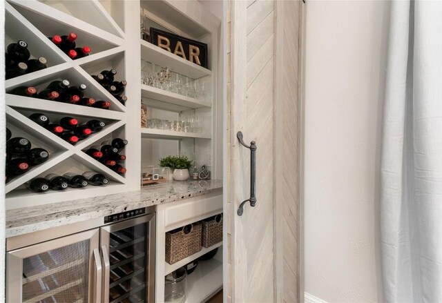 wine cellar featuring wine cooler