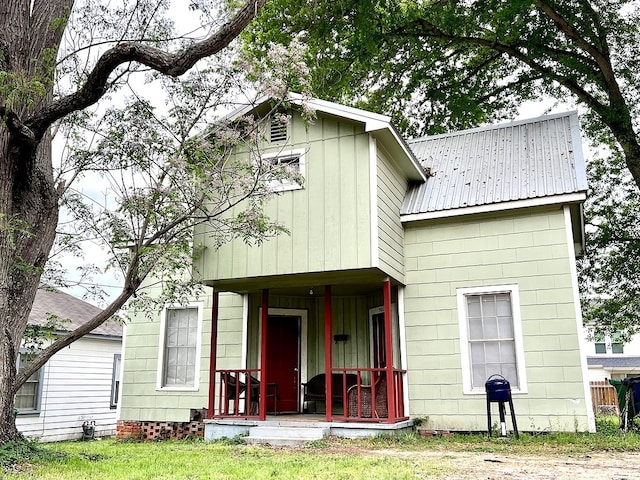 back of house with covered porch