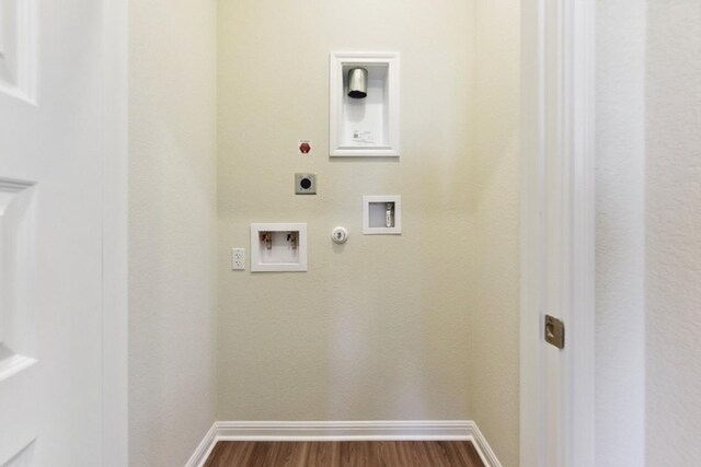 clothes washing area with hookup for a gas dryer, washer hookup, dark wood-type flooring, and hookup for an electric dryer