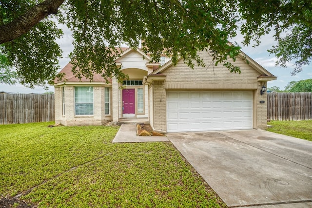 view of front facade with a garage and a front yard