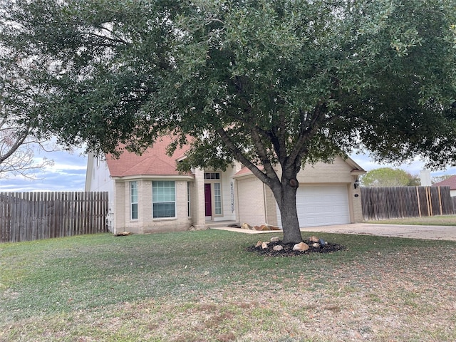 view of front of property featuring a front lawn and a garage