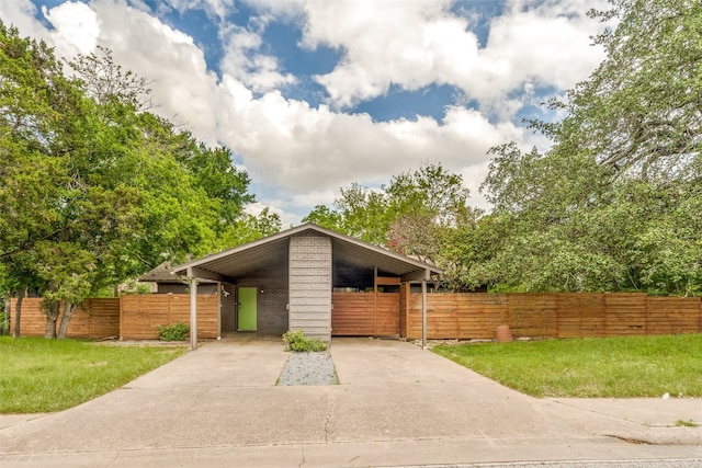 view of front of property featuring a carport