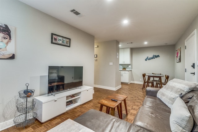 living room with parquet flooring