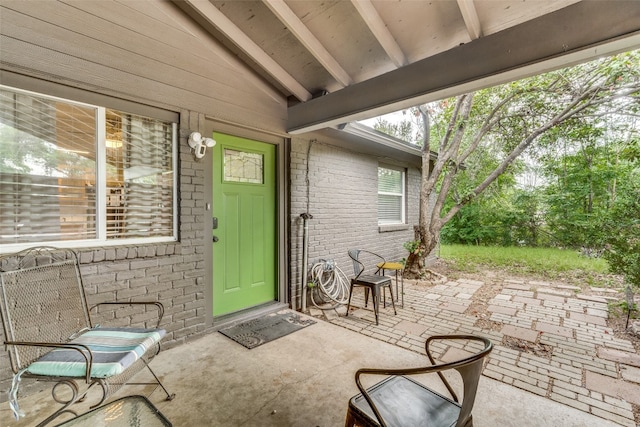 entrance to property featuring a patio