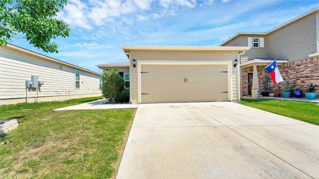 view of front of home featuring a front yard and a garage