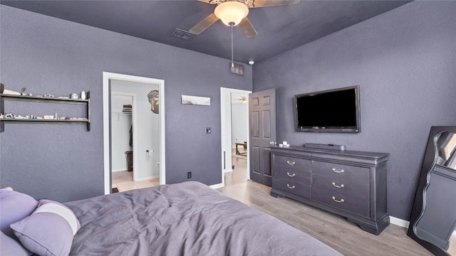 bedroom featuring light hardwood / wood-style floors and ceiling fan