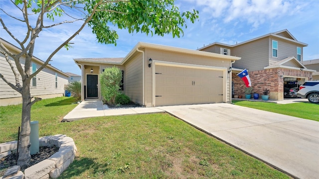 view of front of property with a garage and a front yard