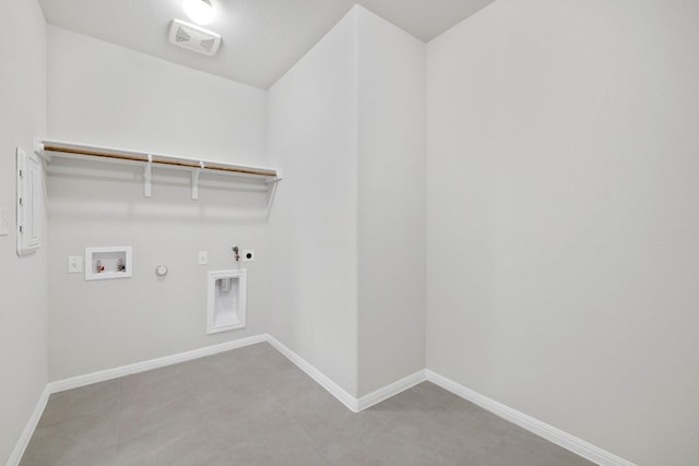 laundry area with hookup for a gas dryer, washer hookup, hookup for an electric dryer, and tile flooring