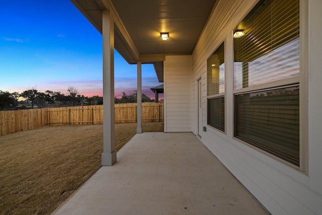 view of patio terrace at dusk