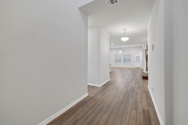 hallway featuring hardwood / wood-style flooring