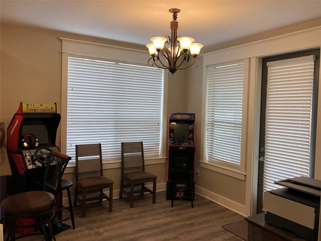 living area with a chandelier and dark hardwood / wood-style floors