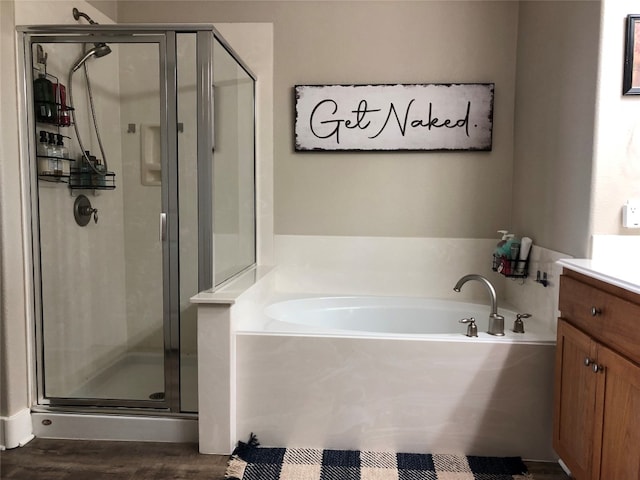 bathroom featuring vanity, shower with separate bathtub, and hardwood / wood-style flooring