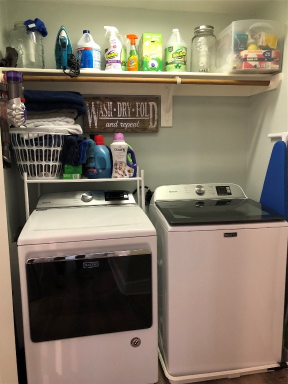 washroom featuring washer and clothes dryer