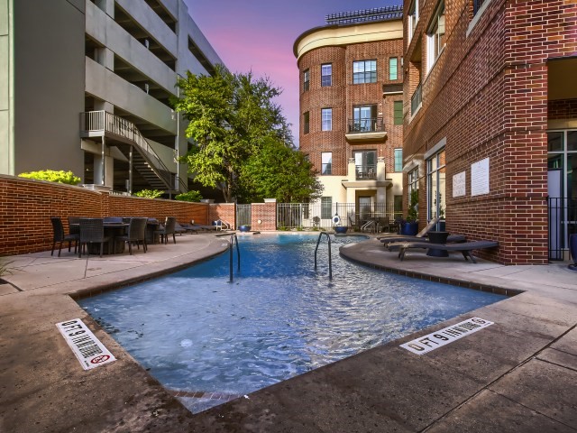 view of pool at dusk