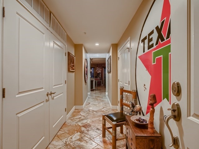 hall with light tile flooring