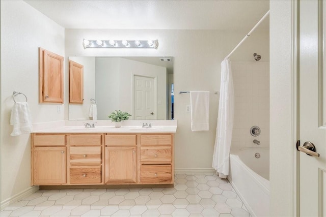 bathroom featuring tile patterned floors, vanity, and shower / tub combo with curtain