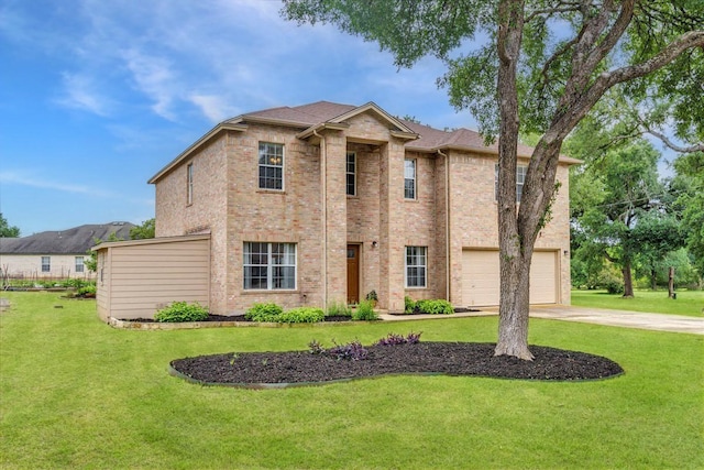 view of front of house featuring a front yard and a garage