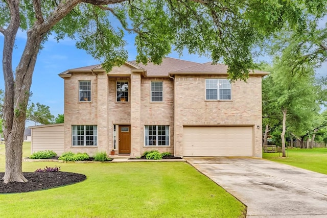 view of front of home featuring a garage and a front lawn