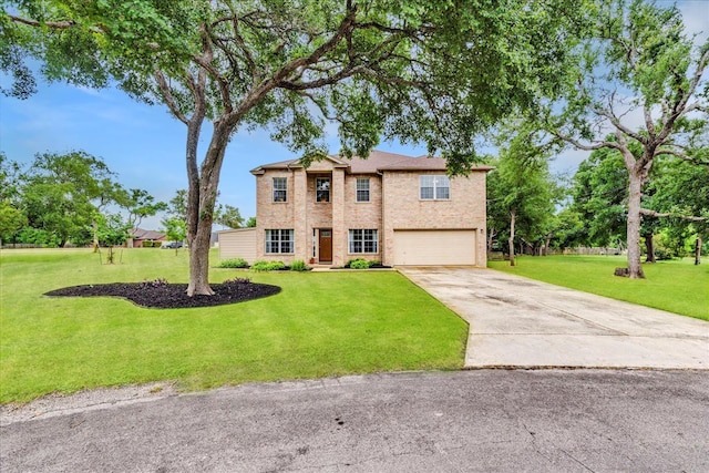 view of front facade with a front yard and a garage